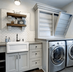 subway tile with farmhouse sink in white laundry room
